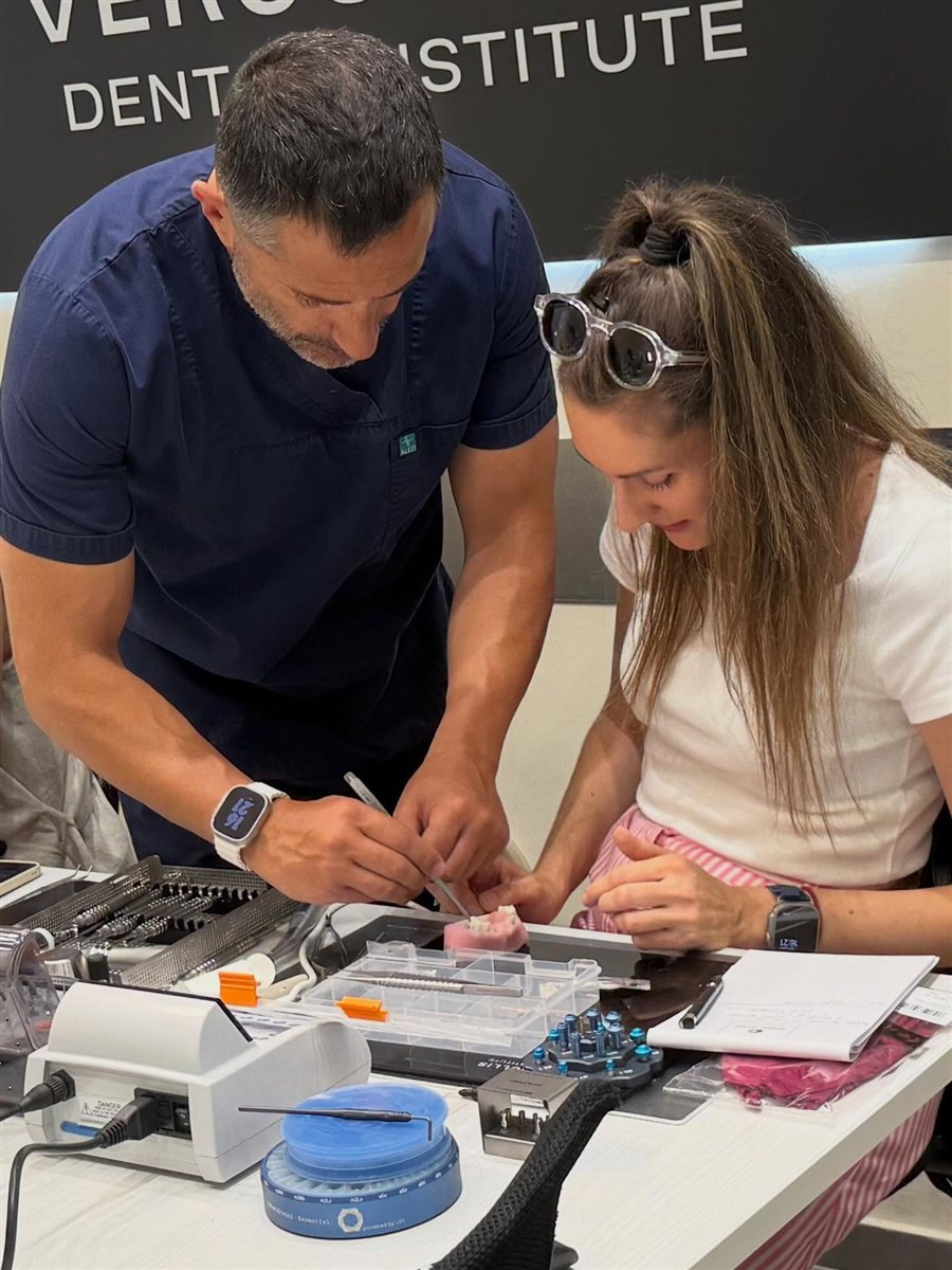 Dr. Vergoullis guiding a participant one on one during hands-on practice